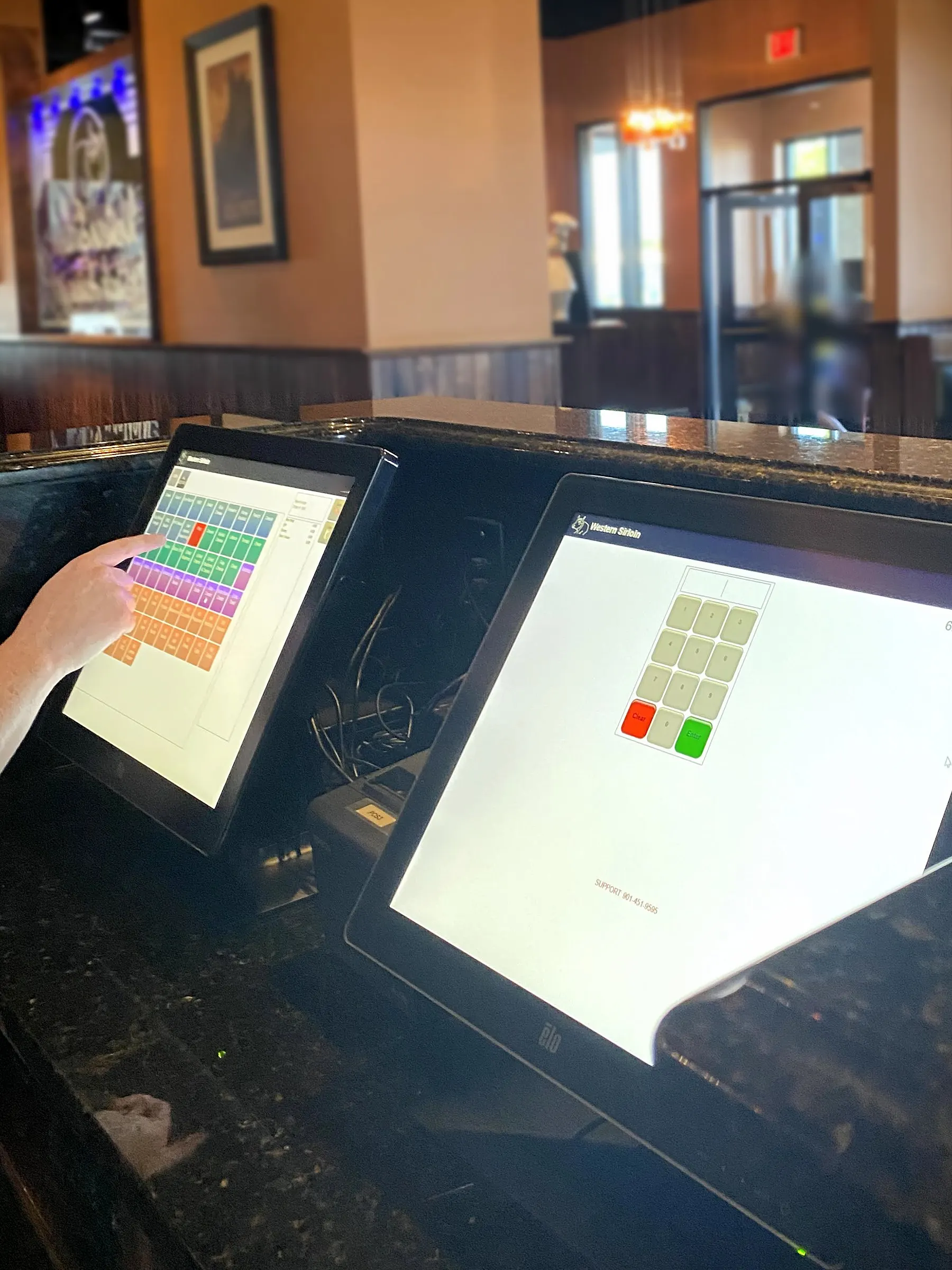 A server ringing in an order on the Propel POS menu screen at Western Sirloin in Decherd, Tennessee